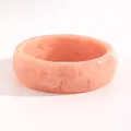 Detail shot of a vintage pink marble resin wide bangle with elegant swirl patterns. - Small Round (M-640) / 22mm / Pink