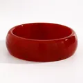 Macro detail of a vintage red marbled resin bangle with a polished glossy finish. - Small Round (6689) / 22mm / Red