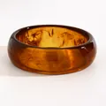 Close-up of vintage marbled resin wide bangle with deep amber tortoiseshell pattern - Small Round (N-575) / 22mm / Light Coffee