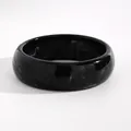 Detailed view of retro black marbled resin wide bangle with polished surface texture - Small Round (WG-0603) / 22mm / Black