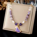Close-up of purple enamel heart pendant on amethyst chip and gold-plated beaded necklace. - Amethyst Purple Heart Enamel Beaded Chain (N4568)