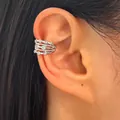 Detailed macro view of a vintage silver multi-layer zircon ear cuff worn on an earlobe - Multi-layer Hollow Ear Cuff (9328) / White K Gold