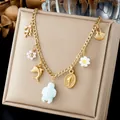Detailed view of ocean-themed gold chain necklace with turtle and dolphin charms - Dolphin Turtle Coral Scallop Multi Charm (N4581)