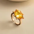 Eleganter vergoldeter offener Ring mit einem großen ovalen gelben Edelstein für Damen - Gold-Kaffee