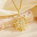 Macro detail of golden sunburst pendant necklace with sparkling stones on stone base - Gold Ferris Wheel Style (T084)