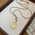 Vintage white resin pendant necklace with hammered gold star detail on brown cord - Hollow Star Style (44#) / Gold/White