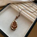Vintage retro resin geometric pendant necklace with layered gold rings on long brown cord - Teardrop and Double Metal Ring Style (35#) / Gold/Coffee