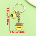 Cute enamel bee and honey jar keychain with 7.8cm size measurement - Gold Bee Honey Jar (ER2311)