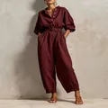Full view of wine red V-neck buttoned jumpsuit with waist belt for casual wear - XS / Top And Bottom / Burgundy