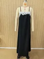 Detailed view of a long black sleeveless dress with white lace trim on neckline. - 3XL / Dresses / Black