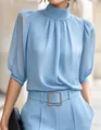 Detail of elegant sky blue mock neck chiffon blouse with chic puff sleeves - XS / Tops / Light Blue