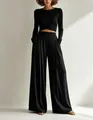 Front view of elegant black long-sleeve crop top and wide-leg trousers set with pockets - XS / Top And Bottom / Black