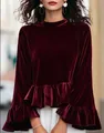 Detail view of a luxurious burgundy velvet top featuring ruffle sleeves and a flared hem. - S / Tops / Burgundy