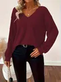 Close-up of a women's burgundy V-neck ribbed knit sweater with a relaxed fit. - S / Tops / Burgundy