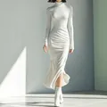Full-body view of white high-neck pleated midi dress showing slim fit and ruched texture - XS / Dresses / White