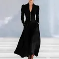 Detail view of an elegant black V-neck maxi dress with bubble sleeves and gold buttons - S / Dresses / Black