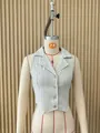 Detailed front view of a sleeveless pinstripe vest with V-neck collar and button closure - S / Tops / Off White