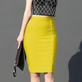Macro view of bright yellow high-waisted bandage bodycon skirt with textured fabric - S / Bottoms / Yellow