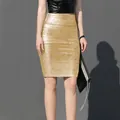 Close-up detail of a metallic gold high-waisted bandage skirt showing textured fabric - S / Bottoms / Apricot Gold