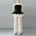 Detail of a chic color-block tube top evening gown with 3D polka dot sheer skirt. - S / Dresses / Black and White