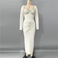 Full view of elegant white long sleeve bandage dress featuring heavy rhinestone embellishments - S / Dresses / White