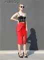 Detailed view of red high-waisted slit bandage skirt and black rhinestone bustier set. - S / Bottoms / Red
