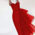 Close-up of an elegant red strapless bodycon dress featuring layered mesh ruffle details - S / Dresses / Red