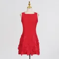 Detailed view of an elegant red sleeveless dress with 3D floral appliques at the hem - S / Dresses / Red