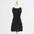 Detailed view of the elegant black sleeveless dress with large 3D flower appliques - S / Dresses / Black