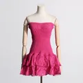 Close-up detail of a fuchsia smocked strapless beach dress with eyelet ruffled hemline - S / Dresses / Rose Red