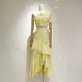 Detail view of yellow two-piece vacation set with 3D floral appliqués and ruffles. - S / Top And Bottom / Yellow