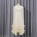 Elegante vestido maxi tipo capa marfil en tela brillante con dobladillo con volantes. - M / Vestidos / Albaricoque