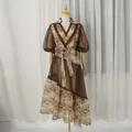 Close-up of French resort style snakeskin print dress with brown lace detailing and V-neck - S / Dresses / Leopard Print