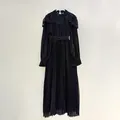 Elegant black pleated chiffon maxi dress with lace stand collar and waist tie detail - Black