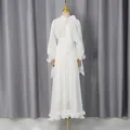 Elegante vestido de noche de gasa blanca brillante con cuello de lazo y mangas de linterna. - S / Vestidos / Blanco