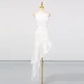 Full view of white resort style dress with asymmetrical ruffled hem and waist cut-outs - S / Dresses / White