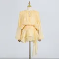 Detailed shot of yellow sweet style pleated dress with tiered ruffles and waist tie - S / Dresses / Yellow