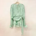 Elegant mint green pleated mini dress with tie-neck and ruffled hem for chic summer wear. - S / Dresses / Green