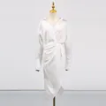 Front view of elegant white V-neck midi dress with asymmetrical split and wrap waist - S / Dresses / White