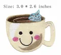 Close-up of a coffee cup embroidered patch with a smiley face, size 3.0x2.6 inches. - 7.6cm x 6.6cm