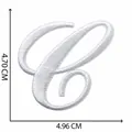 Close-up of white cursive letter C embroidered patch showing size dimensions 4.70cm by 4.96cm - Letter C