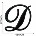 Macro detail of black embroidered letter D patch showing 4.70cm by 4.95cm size - Letter D / Single Piece / Black