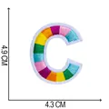 Close-up showing dimensions of the rainbow embroidered letter C patch, 4.9cm x 4.3cm. - Letter C / 4.9x4.3cm