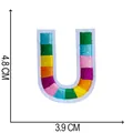 Macro detail of multicolored embroidered letter U patch with 4.8x3.9cm dimensions - Letter U