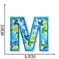 Floral embroidered letter M patch for clothing, size 5.0x5.7cm, blue and white pattern - Letter M
