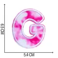 Detail of a pink tie-dye embroidered letter G patch showing 6.5x5.4cm dimensions - Letter G