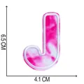 Close-up of pink tie-dye embroidered letter J patch for clothing, size 6.5 x 4.1 cm - Letter J