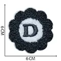 A close-up detail of a 6x6cm chenille embroidery flower patch featuring a black letter D - Letter D / 6x6cm