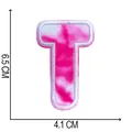Close-up of pink tie-dye embroidered letter T patch with 6.5cm by 4.1cm size markings - Letter T