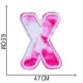 Detail showing tie-dye embroidered letter X patch with 6.5 x 4.7 cm dimensions - Letter X